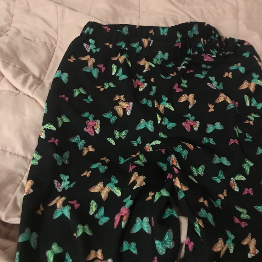 Pants with a butterfly design.